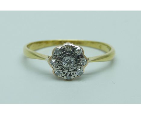An 18ct gold, platinum set diamond cluster ring, 1.6g, O
