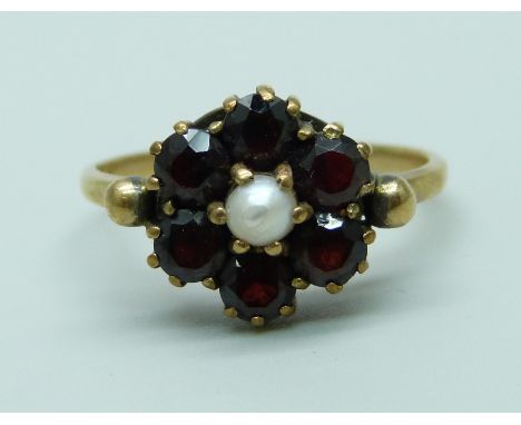 A 9ct gold, garnet and pearl ring, 3.1g, Q