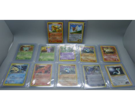 Twelve vintage Pokemon cards including two World Championships 2005 (Nidoran and Nidorina), Gym Hero cards, etc.