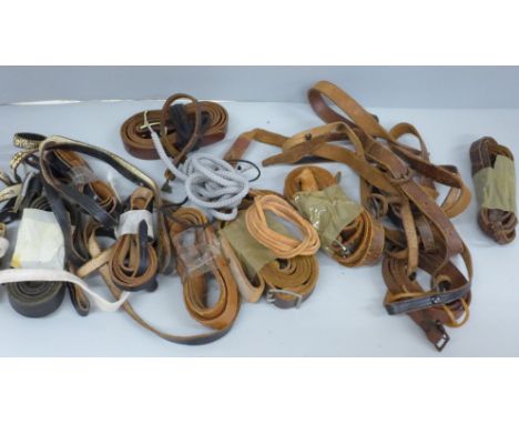 A collection of vintage binocular and binocular case straps and a Lieberman &amp; Gortz catalogue