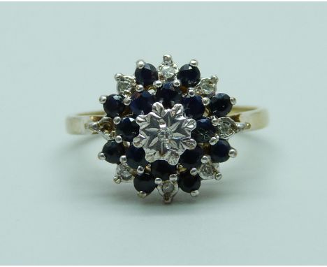 A 9ct gold, sapphire and diamond cluster ring (one diamond missing), 3.4g, R