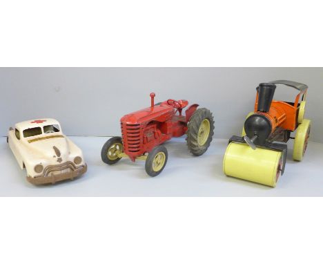 A tin-plate model Ambulance by Arnold, made in Germany, U.S. Zone, a die-cast model tractor and a tin-plate clockwork steam r