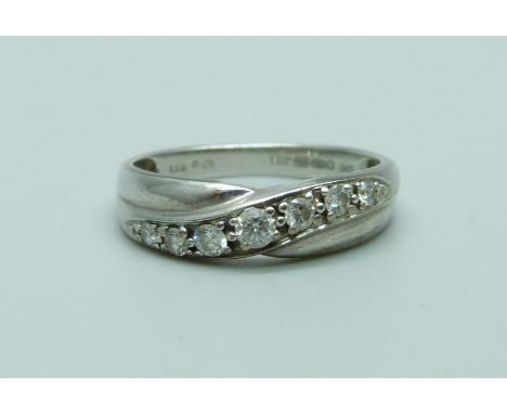 A 9ct white gold ring set with seven diamonds, 0.25ct weight, 2.5g, O