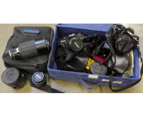 A Minolta X-700 camera and an X-500 camera, three spare lenses, etc.