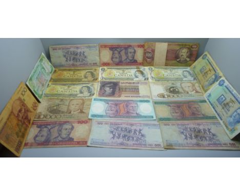 A collection of fifty vintage bank notes, US dollars, South Arabian, Australia, etc.
