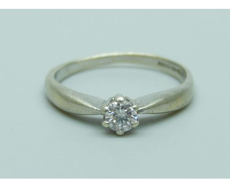 A 9ct white gold and diamond solitaire ring, 1.8g, L
