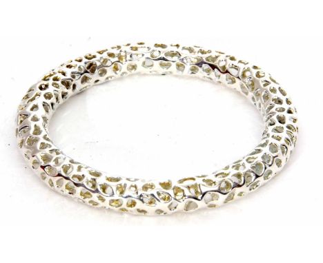 Rachel Galley "Allegro" white metal bangle, of stylised pierced design containing hidden beads, 60mm inside diam, in original