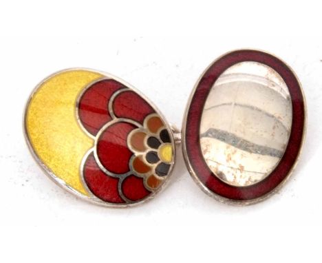 One of two white metal and enamel cufflink