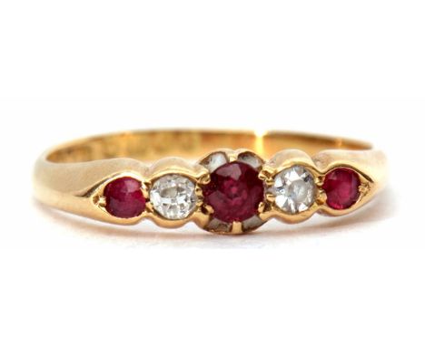 Early 20th century 18ct ruby and diamond five stone ring, alternate set with three graduated rubies and two old cut diamonds,