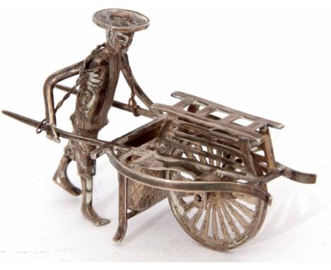 Early 20th century Chinese silver model of a street seller pushing a barrow marked to the base with a single character mark, 