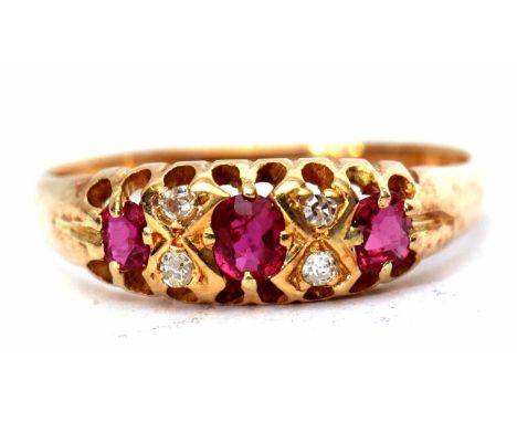 18ct gold ruby and diamond ring featuring 3 oval shaped rubies interspersed with 4 small diamonds, size O