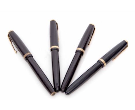 Mixed Lot: comprising four various black and gilt highlighted fountain pens, Parker "Duofold", all four with screw down caps 