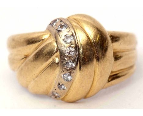 Diamond ring stamped 750, textured knot design highlighted with a wave of 8 small diamonds, gross weight 3.8gms, size I 