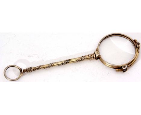 Late 19th century Continental silver gilt folding spectacle with cast ring suspension and with laurel wreath wrapped handle t