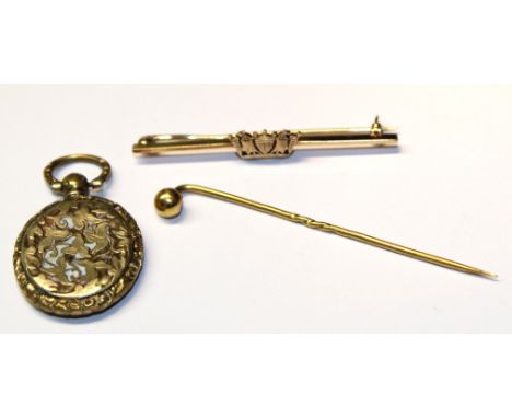 Mixed Lot: yellow metal bar brooch applied with a central crown motif, 19th century gilt metal memoriam pendant with a glazed