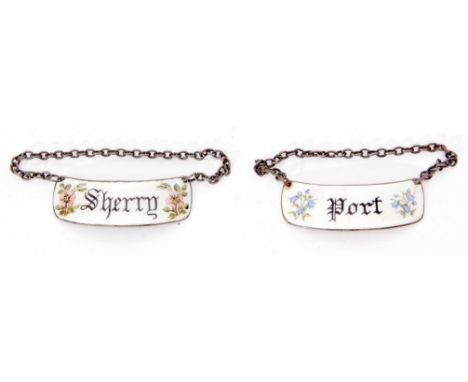 Two Elizabeth II silver and enamelled decanter labels, each of curved rectangular form with clear enamel and floral detail an