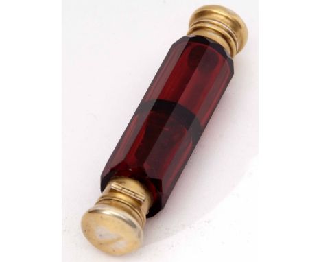 Late 19th century ruby glass and gilt metal mounted double ended scent bottle of faceted cylindrical form with hinged and spr