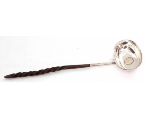 George III toddy ladle, the oval polished bowl set with a George II silver sixpence dated 1746 and later gilded to a twisted 