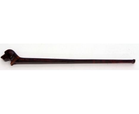 Early 20th century composite cigarette holder with elongated rectangular stem and finial modelled in the form of a dog's head