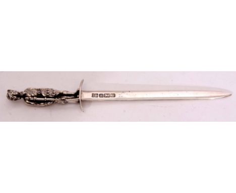 Elizabeth II silver letter opener with plain and polished blade with shaped cross guard and with cast and applied figural fin