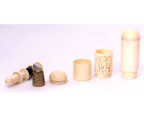 Late 19th century ivory sewing compendium of cylindrical form with screw off cover, containing a base metal thimble to a plai