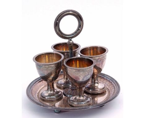 Victorian electro-plated egg stand, the saucer base raised on four ball feet marked with a registration diamond to a central 