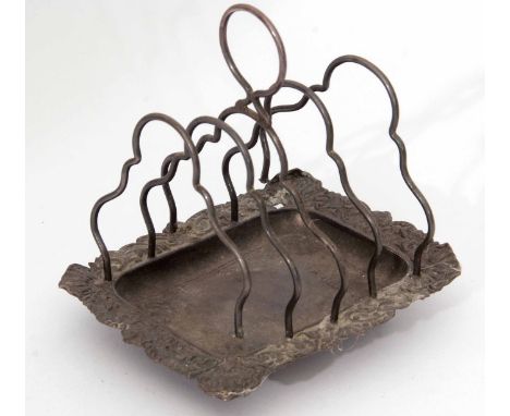 Victorian four-slice toast rack, the rectangular base with embossed rim (a/f) and raised on four ball feet to five shaped wir