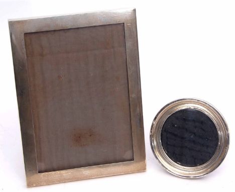 Mixed Lot: two various silver mounted easel backed photograph frames, the first of plain polished rectangular form with oak b