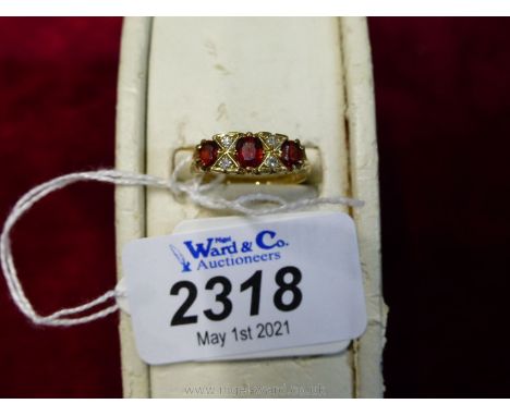 A Ruby and Diamond Gypsy set ring.
