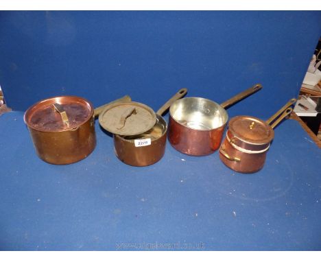 A small quantity of copper pans with lids, one with ceramic liner.