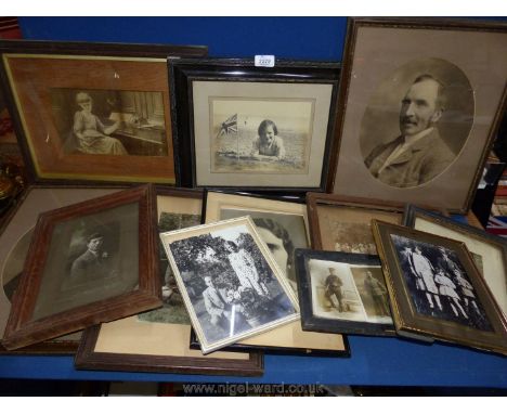 A box of framed early 20th century portrait photographs etc.