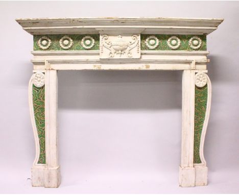 QA GEORGIAN CARVED WOOD AND PAINTED FIRE SURROUND with urn carving and roundels. 3ft wide x 6ft 3ins high.