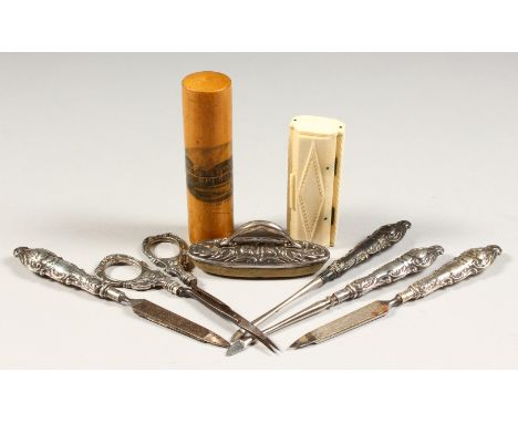 A CARVED BONE SNUFF BOX, Mauchline ware bodkin case and various manicure accessories.