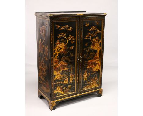 A 20TH CENTURY BLACK LACQUER AND CHINOISSERIE DECORATED TWO DOOR CUPBOARD, supported on bracket feet. 4ft 6ins high x 3ft 2in