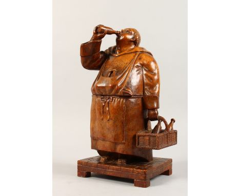 A VERY RARE 19TH CENTURY BLACK FOREST CARVED WOOD TOBACCO BOX AND COVER formed as a portly man carrying a basket with two win