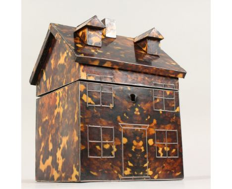 A FAUX TORTOISESHELL COTTAGE SHAPED TEA CADDY. 6.5ins wide.