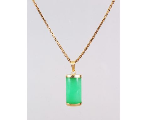 A GOLD CHAIN with jade pendant.