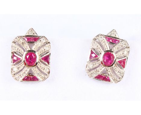 A PAIR OF 9CT GOLD RUBY AND DIAMOND EARRINGS.