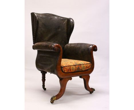 A GOOD 19TH CENTURY MAHOGANY FRAMED WING ARMCHAIR, the showwood frame having scrolling arms, curving front legs, turned back 