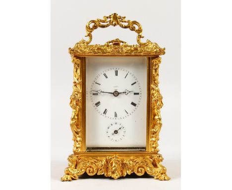 A GOOD 19TH CENTURY FRENCH ORMOLU CARRIAGE CLOCK in an ornate case with repeat action and alarm. 6ins high.