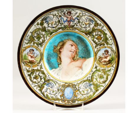 LEON PARVILLEE AND BERTHE ROLLOT, A MAJOLICA CHARGER, the centre painted with a portrait bust of a young lady. 12.75ins diame