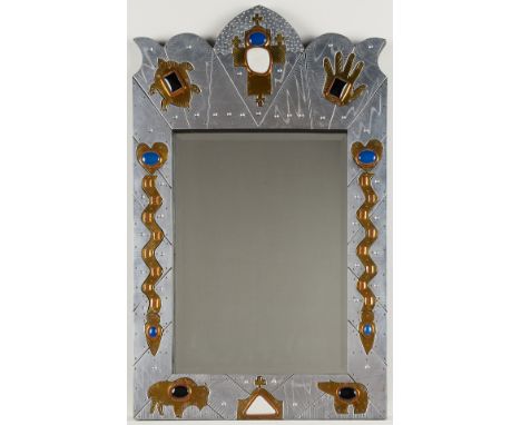 Thom "Tex" Wheeler (American, b. 1946). Mixed metal wall mirror decorated with a combination of Christian and Native American