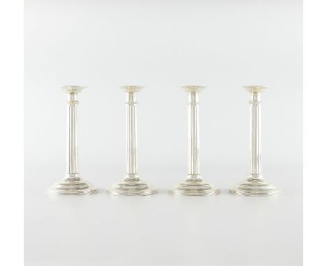 Group of four sterling silver candle sticks in the form of Roman Doric columns. All marked sterling and numbered 766 along th