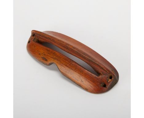 One pair of Native American Inuit carved wooden snow googles.Length: 5 in x width: 1 1/2 in.Condition: The item is in fair co