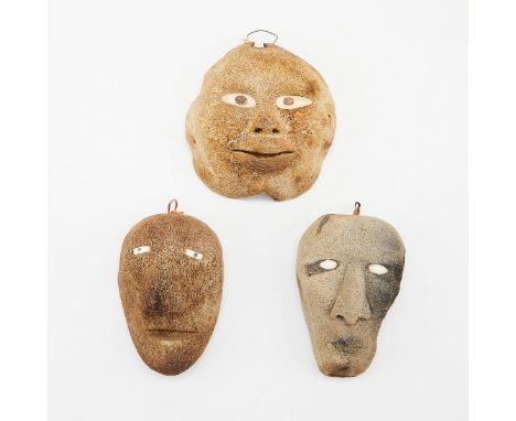 Group of three Native American Inuit bone masks. Each carefully carved face with whiter bone eyes.Height ranges from 3 1/4 in
