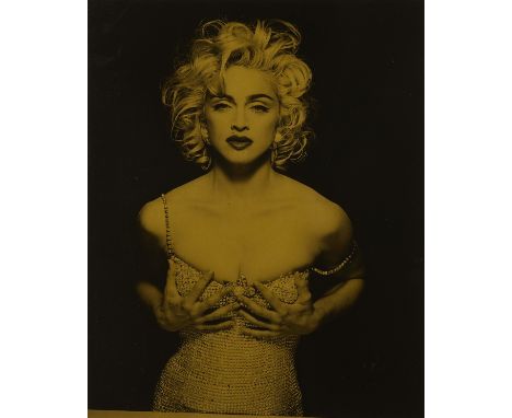 Patrick Demarchelier (French, 1943-2022). Silver gelatin print photograph on gold paper depicting the pop superstar Madonna. 