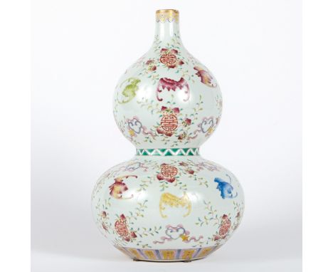 Chinese porcelain double gourd vase, decorated with a design of bats and shou symbols in famille rose enamels. Marked along t