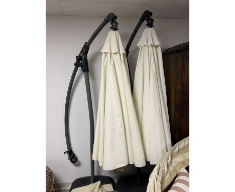 GARDEN FURNITURE:  a very large garden parasol, on black all weather base/stand, with water hole to weight item. Parasols in 