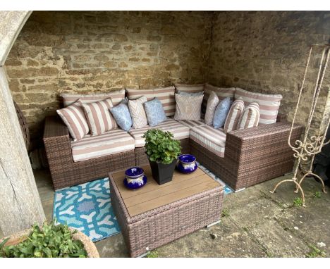 GARDEN FURNITURE: A large garden L shaped sofa and brown striped cushion set, with small matching free standing tables, bears