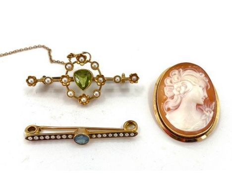 An 18ct gold peridot and split pearl set brooch and a 9ct bar brooch set with aquamarine and pearl and an 18ct gold set cameo